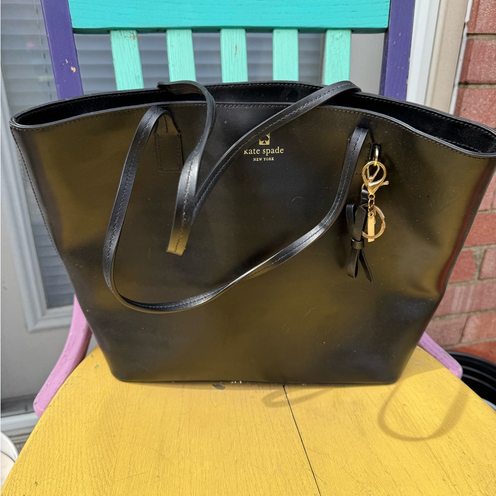 Kate Spade Black Tote with Sleek Design and Gold Accent